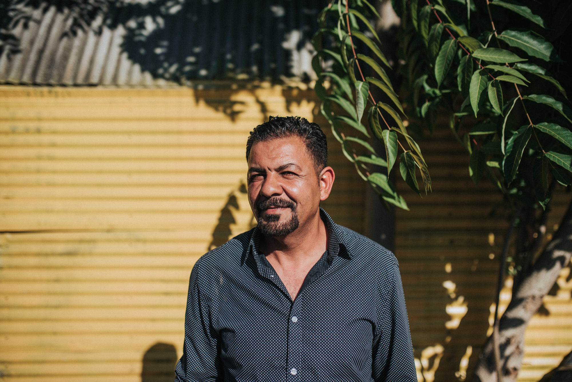 Mazin, founder of Lami Auto, looks sternly into the distance
