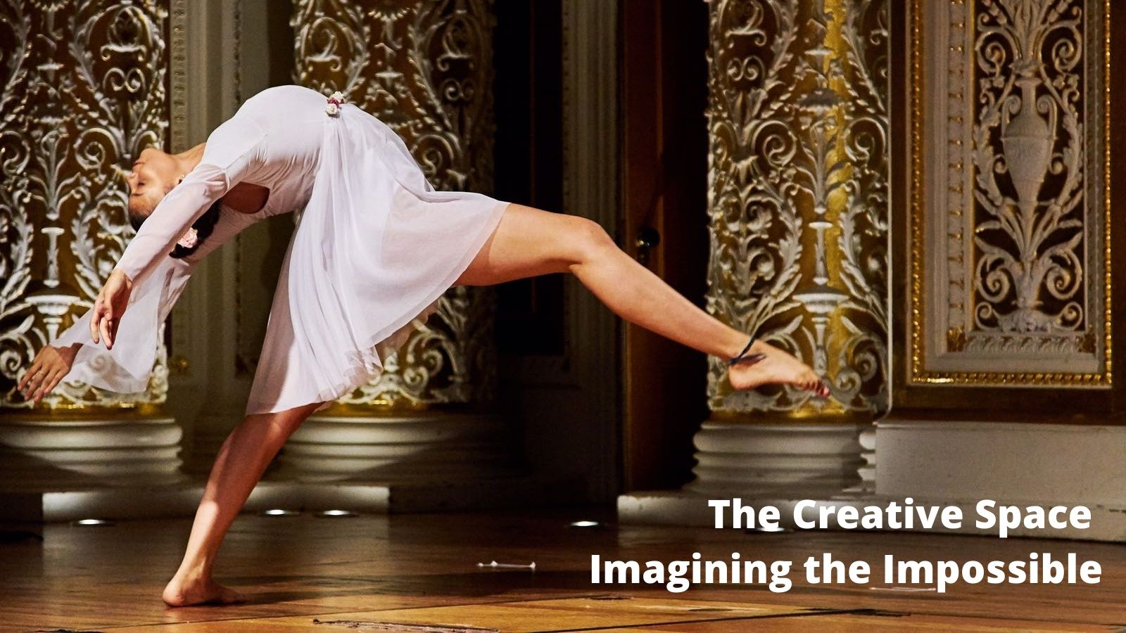 Ballerina in white dress arching back on stage with graphic text the creative space imagining the impossible 
