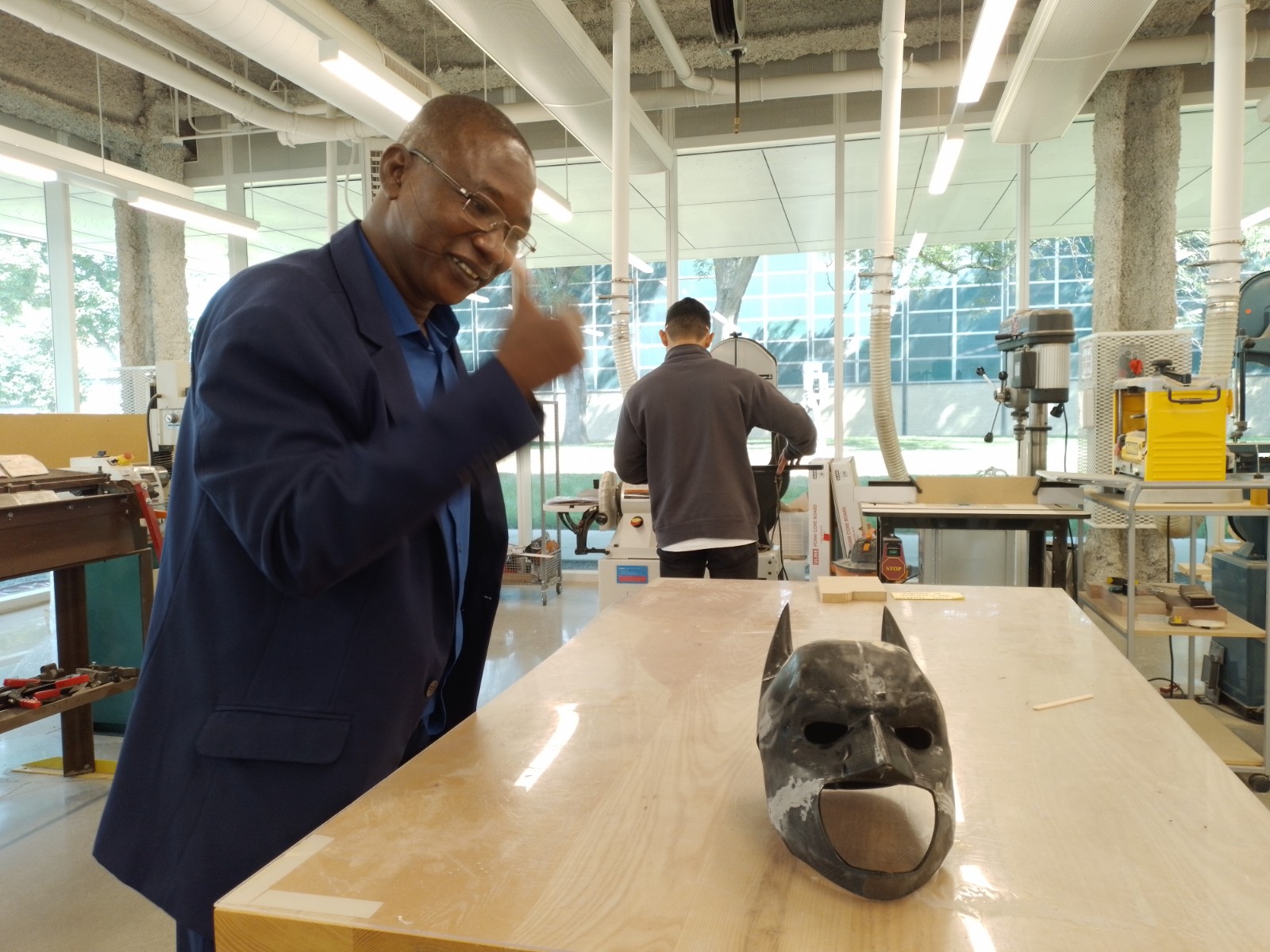 Adamou Yazi amazed by a 3D printed mask at Illinois Institute of Technology