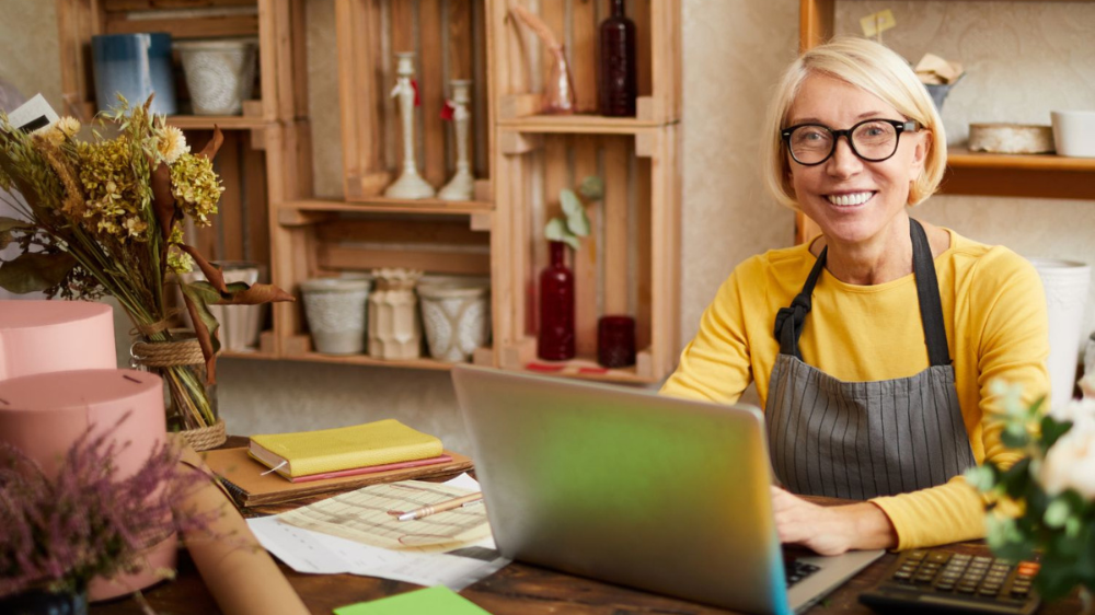 blond lady with glasses in yellow sweater
