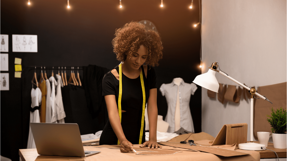 girl with afro at desk