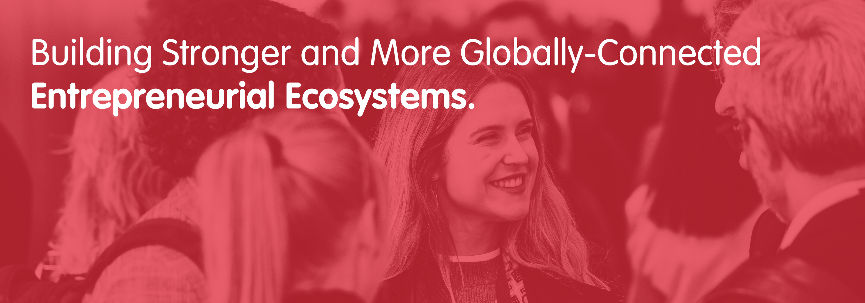 Group of people chatting, smiling. Text overlay: Stronger and more globally-connected entrepreneurial ecosystems.