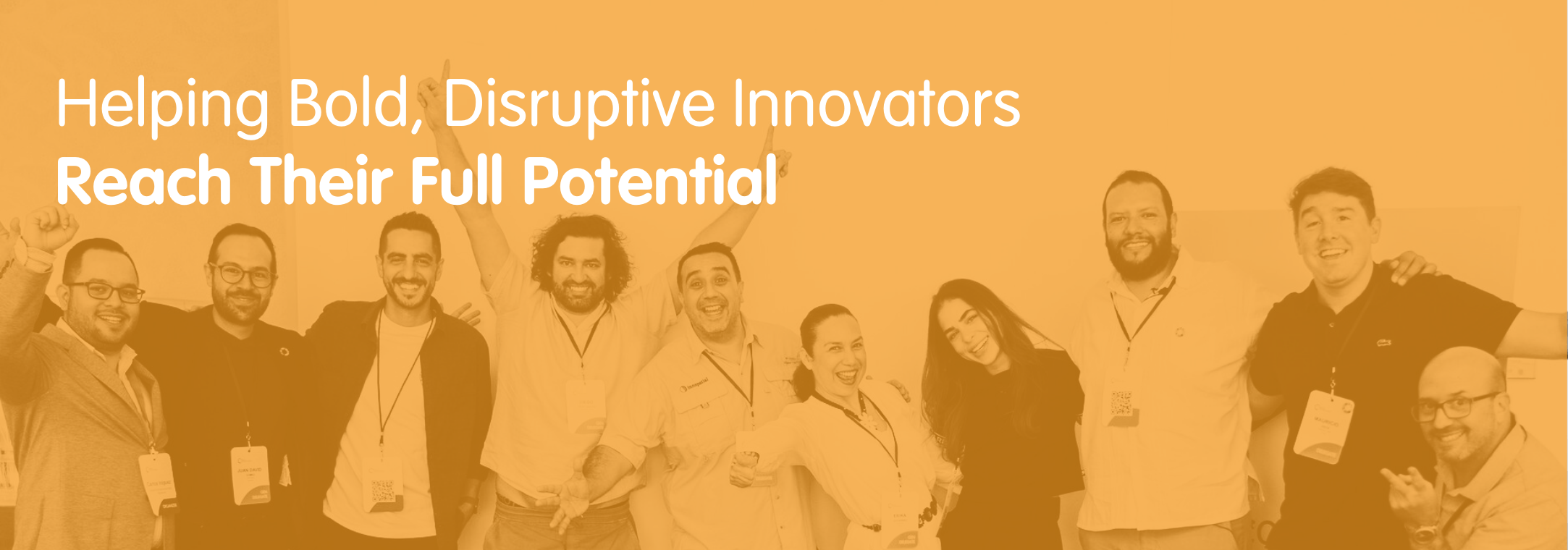 Group of entrepreneurs facing the camera, smiling. 