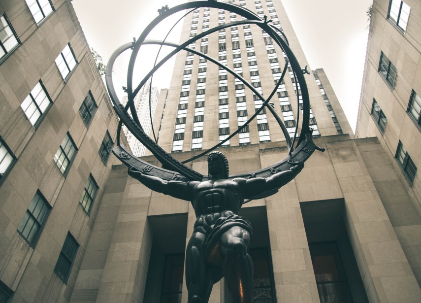 Statue of man holding globe