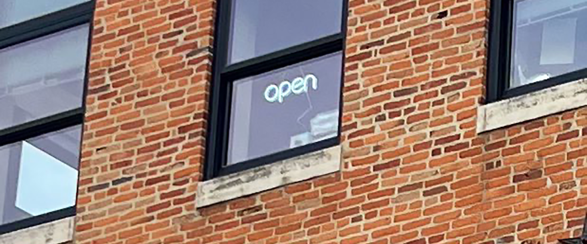 Open sign in office window