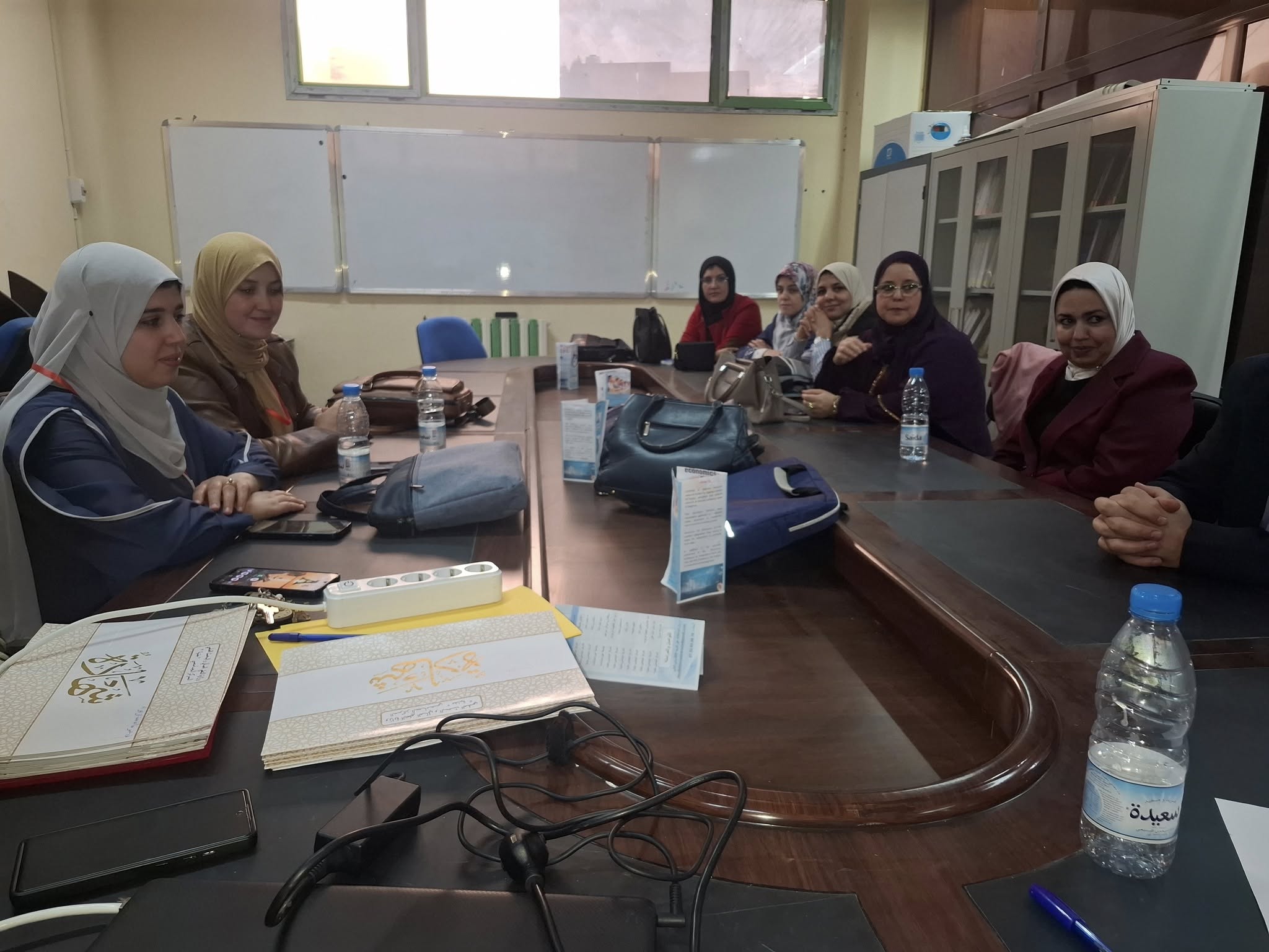 Image of the organizing committee of the national conference at the Maghnia University Center, featuring the faculty members and coordinators responsible for planning and managing the event’s activities.
