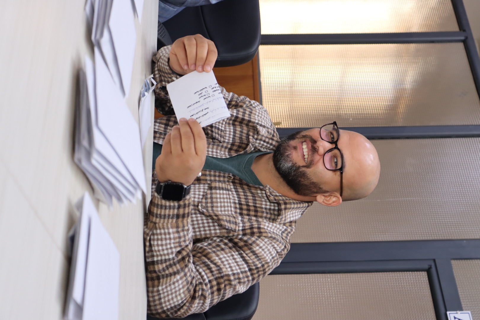 Image showing Dr. Khathir Chine, Director of the Business Incubator, reviewing and evaluating student project ideas during the Idea Box assessment session.