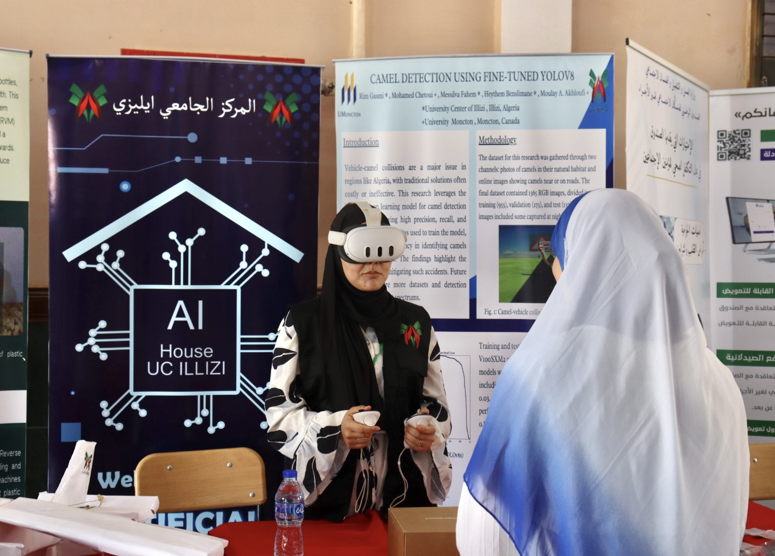 Image of the AI House booth at the University Center of Illizi, showcasing its initiatives and digital innovation services as part of the professional exhibition.