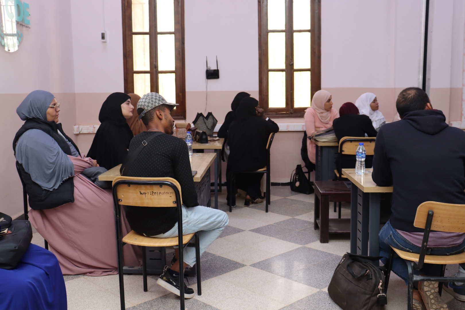 Image showing workshop attendees, including students and faculty members, listening attentively and engaging with the pitching skills session.