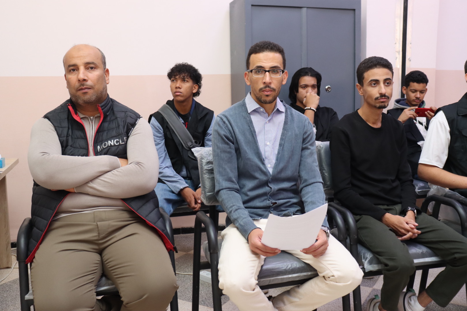 Image showing workshop attendees, including students and faculty members, listening attentively and engaging with the pitching skills session.