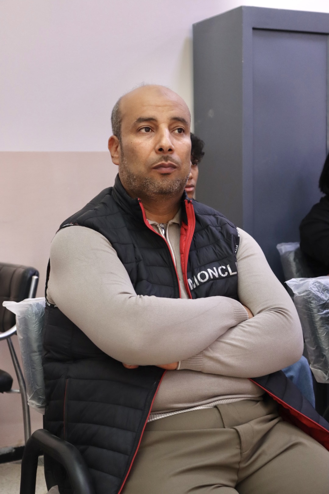 A group of faculty members attending the workshop, following the session attentively and contributing to the discussion.