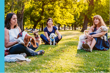 girls with dogs in park