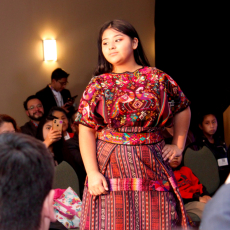 Girl modeling red Guatemalan dress