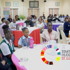 Startup Huddle St. Lucia. Audience listening intently to announcements.