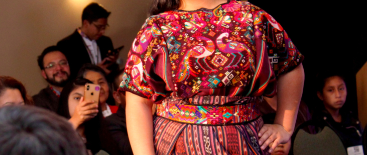 Girl modeling red Guatemalan dress