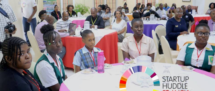 Startup Huddle St. Lucia. Audience listening intently to announcements.