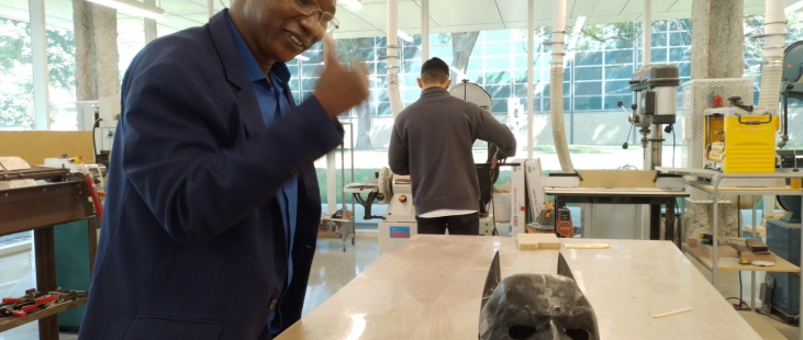 Adamou Yazi amazed by a 3D printed mask at Illinois Institute of Technology