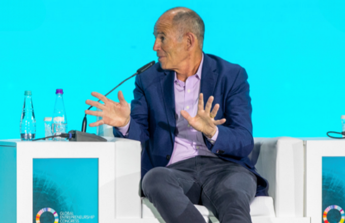 Marc Randolph speaking on stage