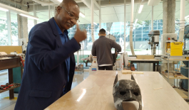 Adamou Yazi amazed by a 3D printed mask at Illinois Institute of Technology