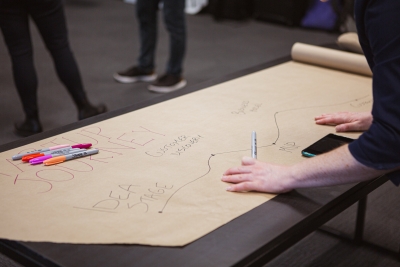 Person making poster of entrepreneurship journey